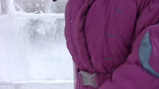 Small girl goes on icy labyrinth, blind alley