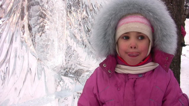 Small girl and icy sculpture