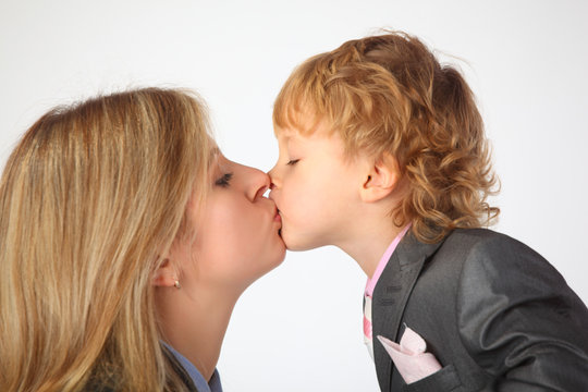 Mother and son kiss