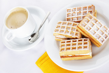 Breakfast with waffles and  coffee