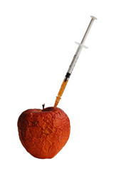 wrinkled old apple and syringe, on the white background