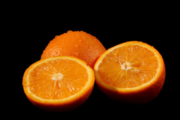 Sliced orange on black background