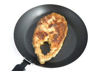 fried fish steak on griddle