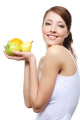 laughing  young woman with fruits