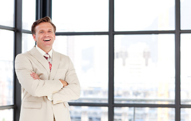 Smiling senior businessman with folded arms