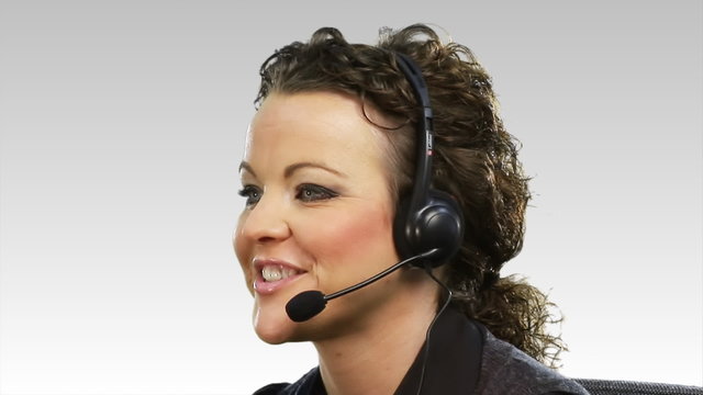 Brunette businesswoman with a headset on