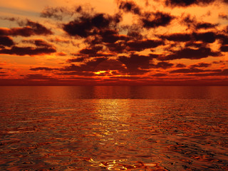 beautiful orange sunset above the surface of tropical sea