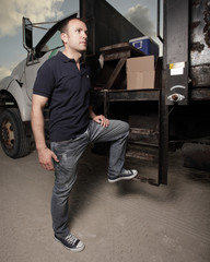 Obraz na płótnie Canvas Delivery driver with a work truck