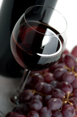 Red wine and grapes