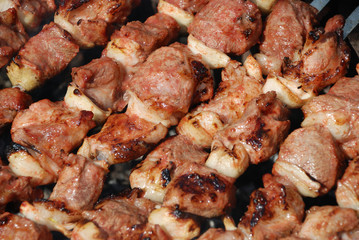 Preparation of meat on fire