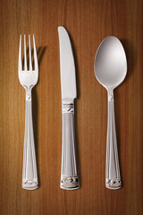 gold gold fork, knife and spoon