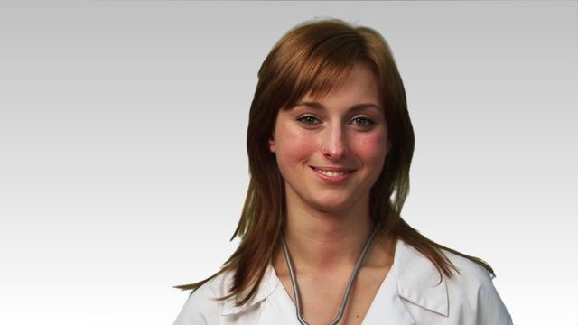 Smiling female doctor in front of the camera