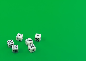 The dice on  green   background.