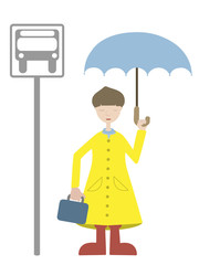 Young Man waiting for transport in rain coat