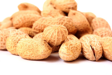 Many peanuts on white background
