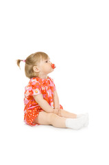 Small smiling baby in red dress with toy cup