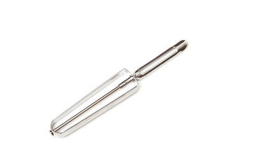 Potato peeler isolated on a white studio background.
