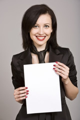 Naklejka premium Brunette businesswoman holding white paper