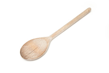 Wooden spoon isolated on a white studio background.