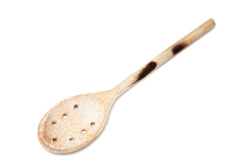Wooden spoon isolated on a white studio background.