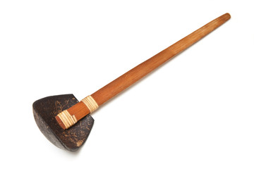 Wooden spoon isolated on a white studio background.