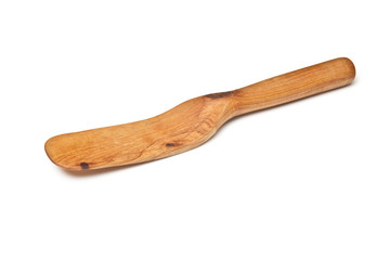 Wooden spatular  isolated on a white studio background.