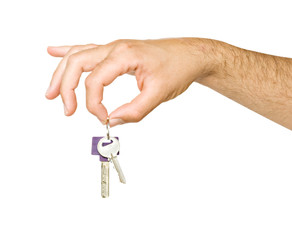 Close up of hand holding keys isolated on background