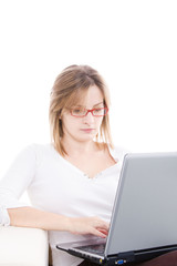 Naklejka premium Woman with laptop on the couch