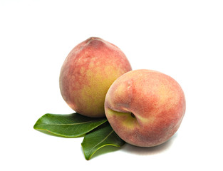 Two peaches isolated on white background