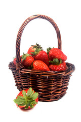 Fototapeta na wymiar Closeup of strawberries in a basket on a white background