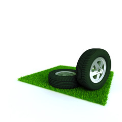 Obraz na płótnie Canvas car wheels on a lawn with a green bright grass