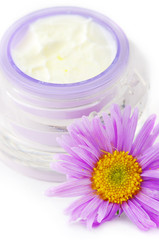 Fototapeta na wymiar Closeup of open container of cosmetic face cream on white backro
