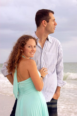 beautiful young couple at the ocean