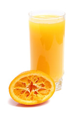 orange and juice in glass