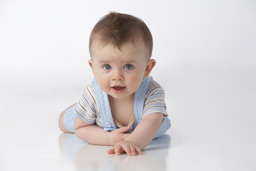 Blue eyed boy on white