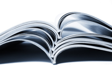 stack of magazines and books