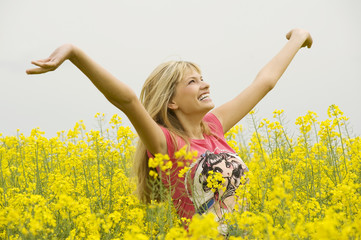 Naklejka na ściany i meble happy girl in yellow field