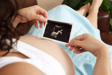 Pregnant woman with ultrasound scan