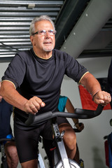 Senior man cycling