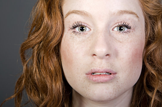 Studio Shot Of An Attractive Red Headed Teenager