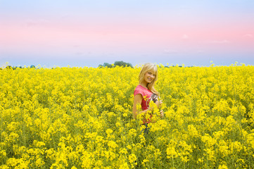 blond girl in yellow field