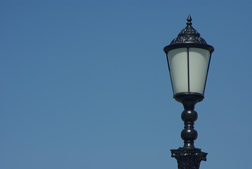 Fototapeta na wymiar Lamp on blue sky background