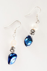 blue earrings isolated