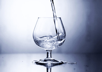 glass on a mirror and reflection