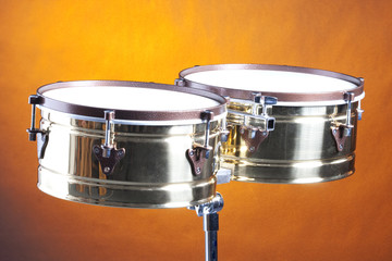 Fototapeta na wymiar Timbales Drums Against Gold Background