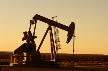 Working oil pump in rural Texas at sunset - 14466546