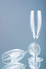 Two champagne glasses isolated on gray