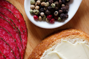 Salami slices with bread and spices