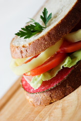Sandwich with salami in the kitchen