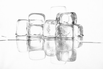 Ice cubes shot on white glass with a white background
